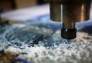 Metallic detail of lathe machine over working surface